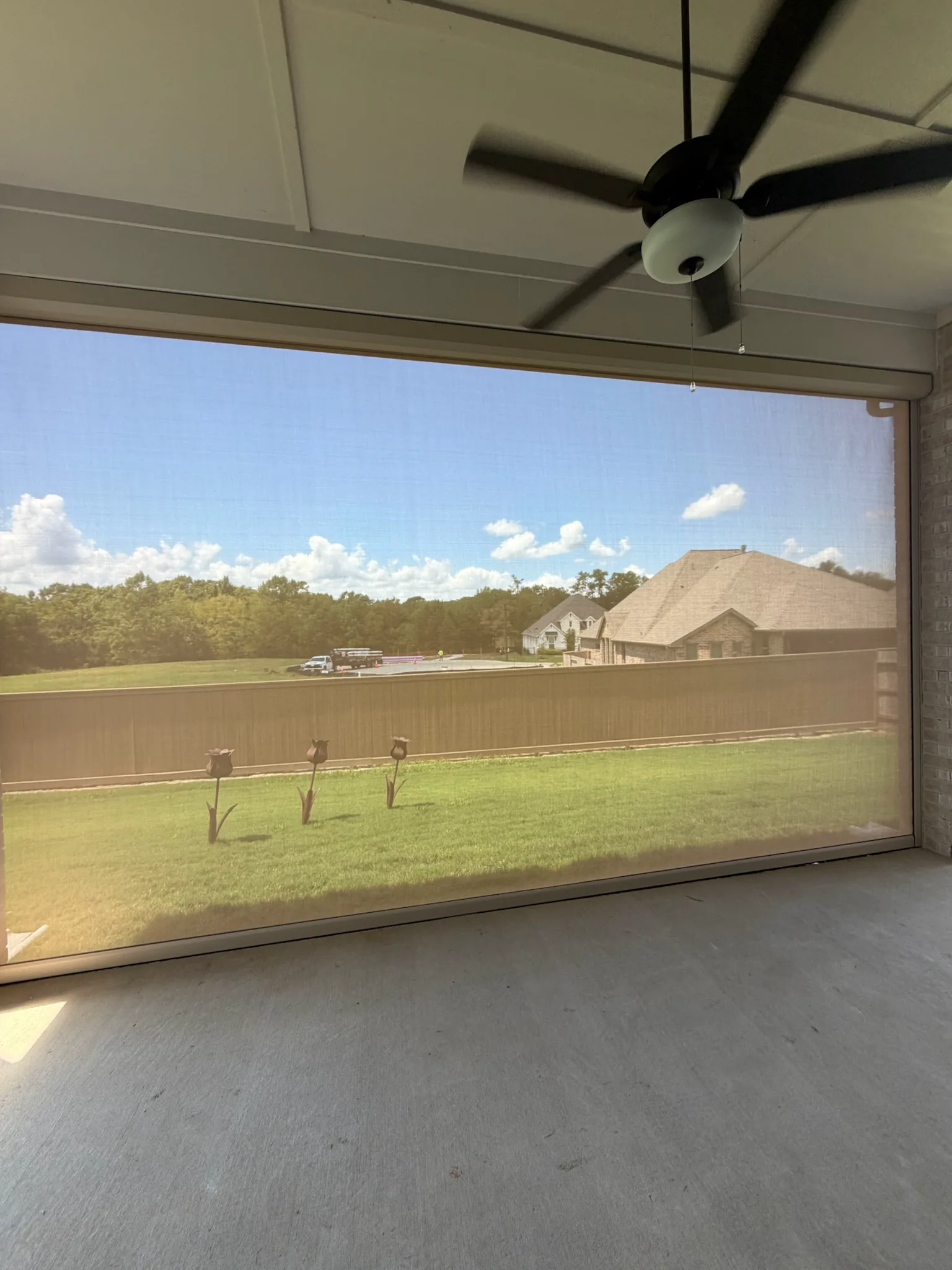 View through a fully deployed TMAX retractable patio screen