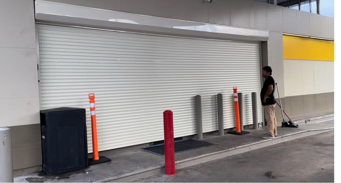 Large white commercial roll-down shutter