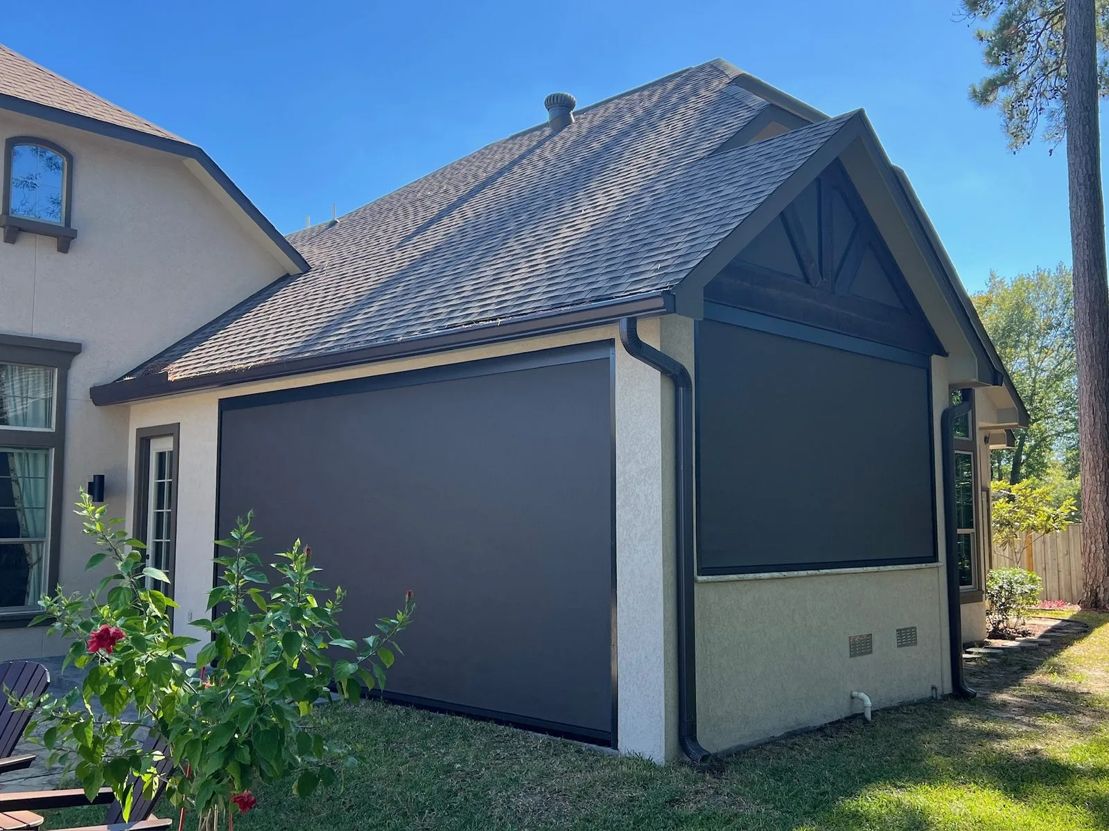 Black TMAX exterior shades wrapping a residential corner