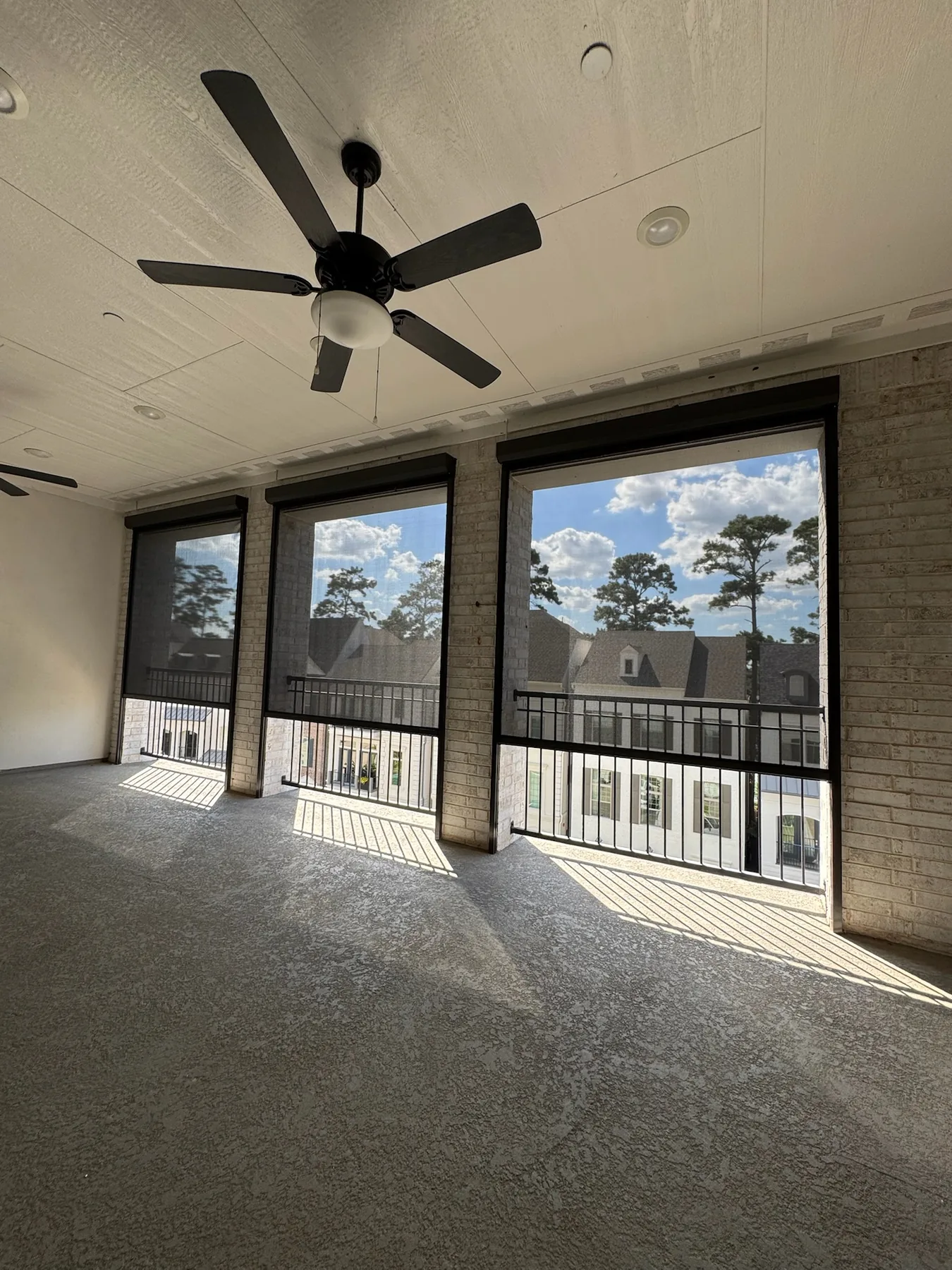 Exterior shades enclosing an elevated balcony