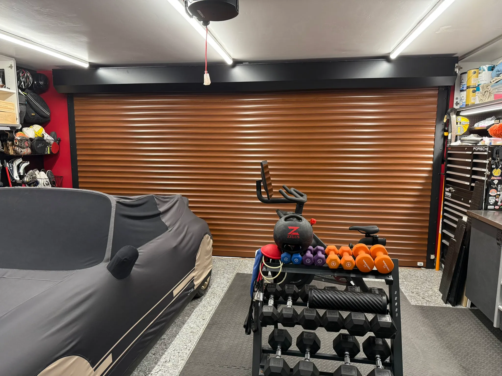 Wood-grain TMAX roll-up garage door viewed from inside a finished garage
